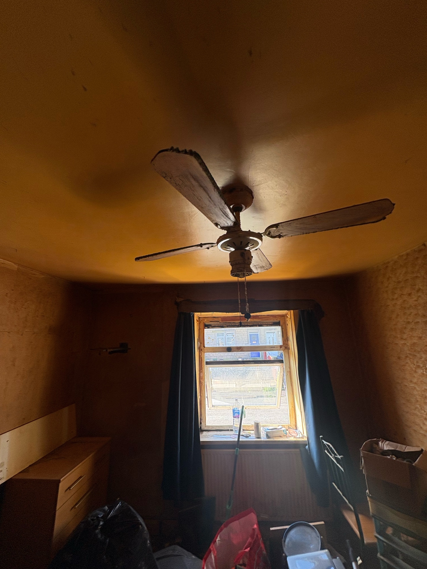 Nicotine-saturated room — walls, ceiling and fan