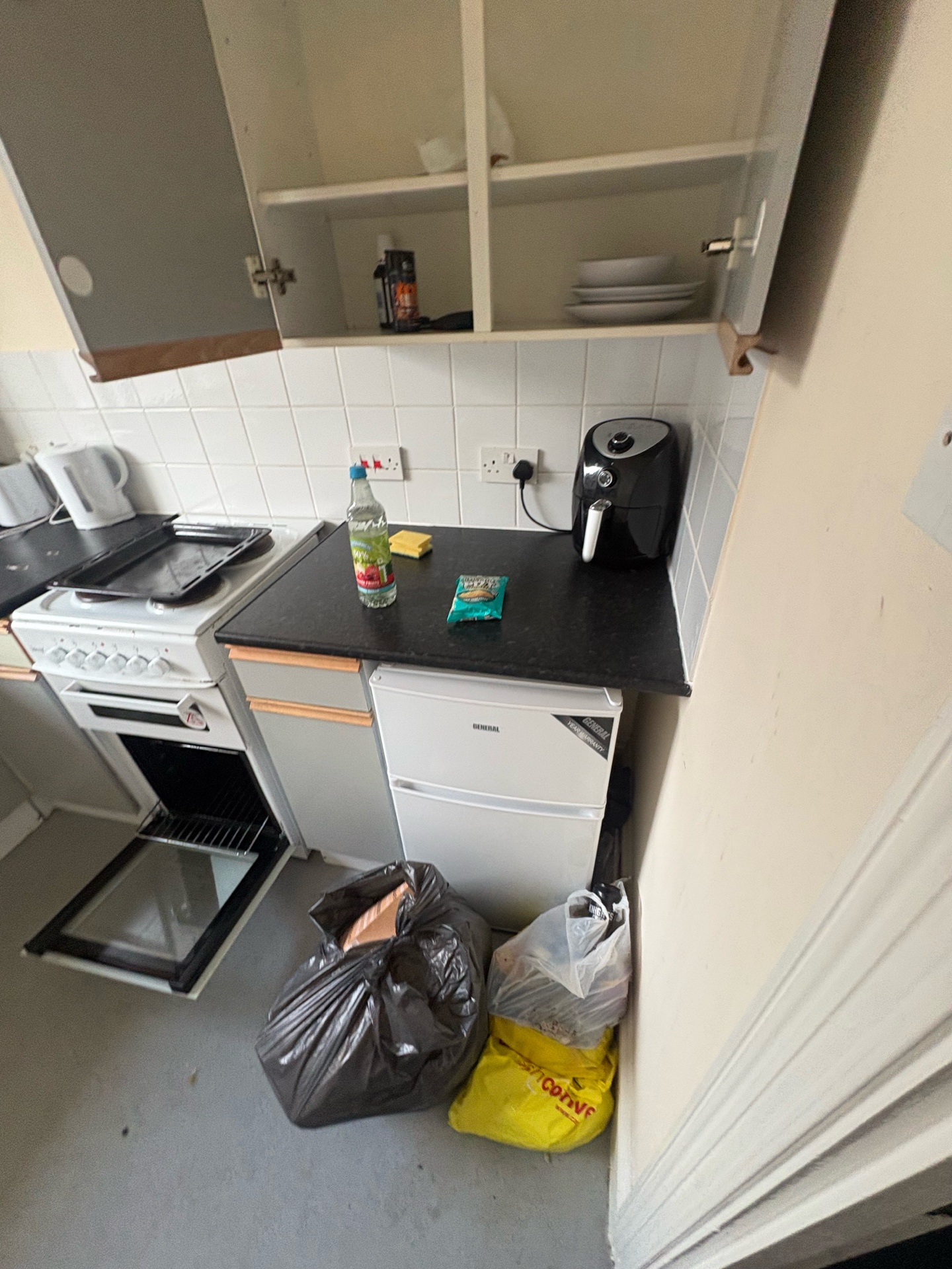 Void property kitchen before cleaning — waste and hazards